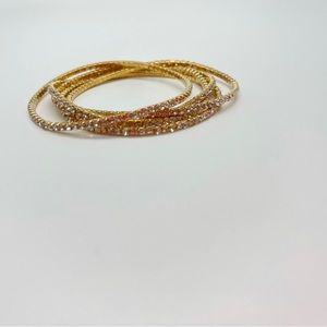 Women’s gold studded bangles.